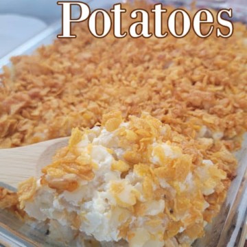 Funeral Potatoes text over a large casserole dish with cereal covered hashbrown potatoes
