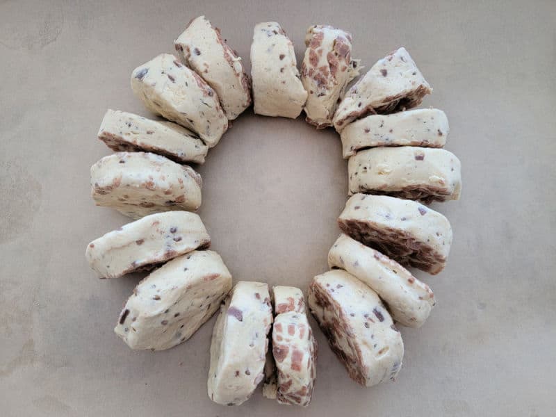 Cinnamon rolls in a circle on parchment paper