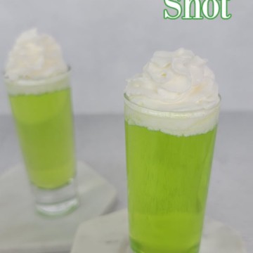 Scooby Snack Shot text over two green cocktail shots with whipped cream garnish