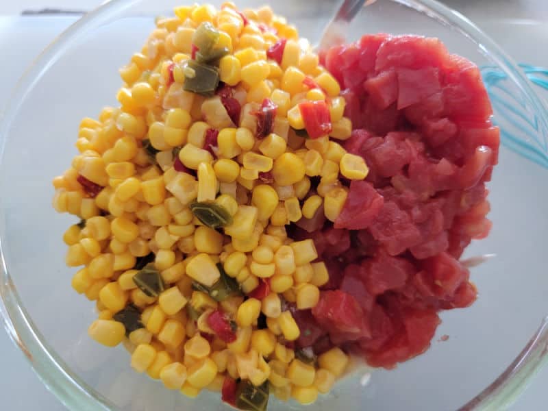 Southwest corn and diced tomatoes in a glass bowl 