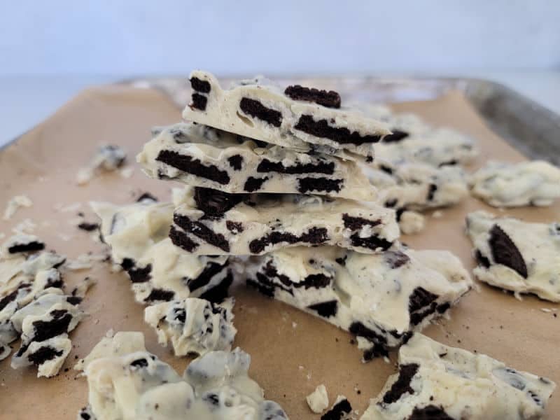 Stack of Oreo Bar on a parchment lined baking sheet. 