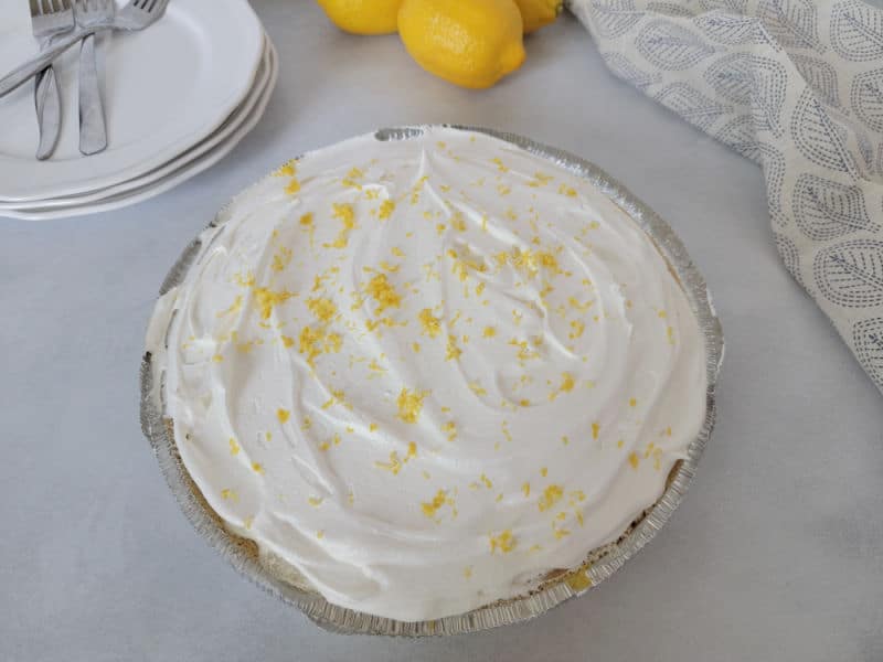 No bake lemon pie with lemon zest on top of it. 