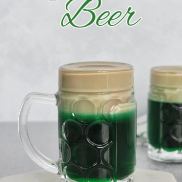 Leprechaun Beer text over a green layered shot in a mini beer glass