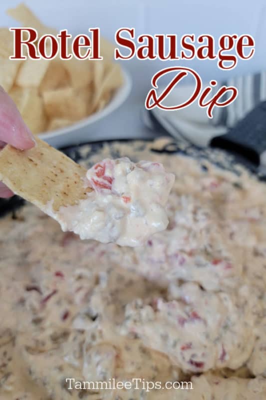 Rotel sausage dip text over a hand dipping a tortilla strip into dip in a cast iron skillet 