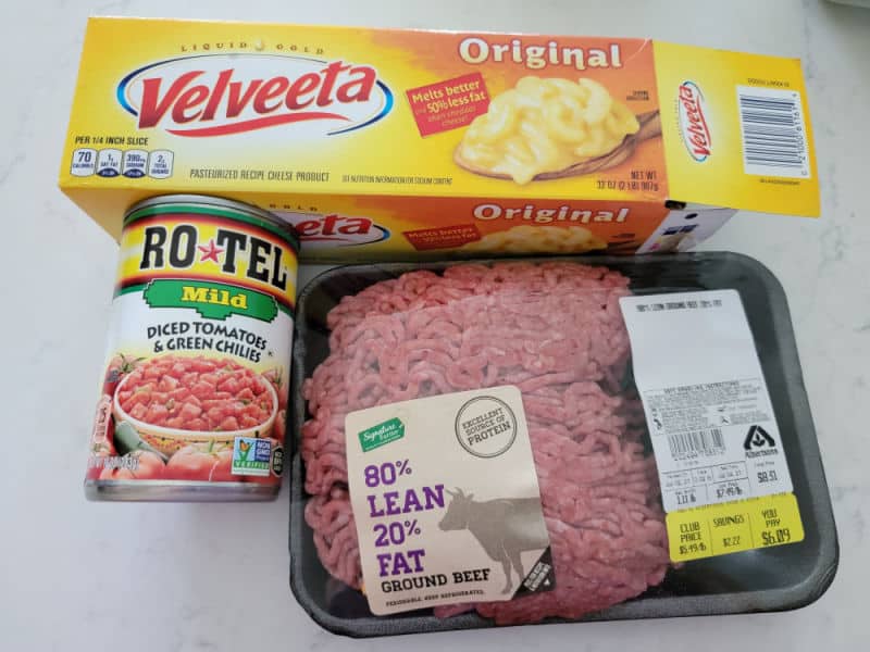 Velveeta original box, Rotel Mild Diced Tomatoes and Green Chilies, and 80/20 ground beef in a package