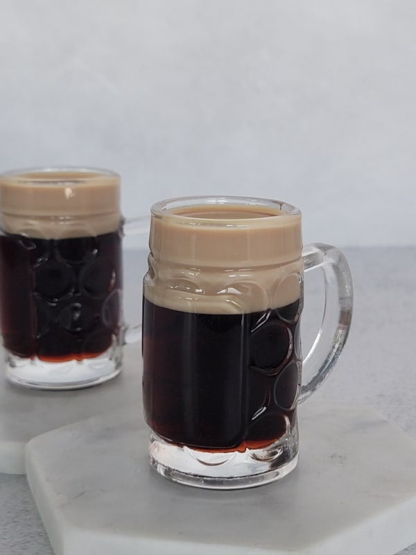 2 Baby Guinness Cocktails in mini beer glasses