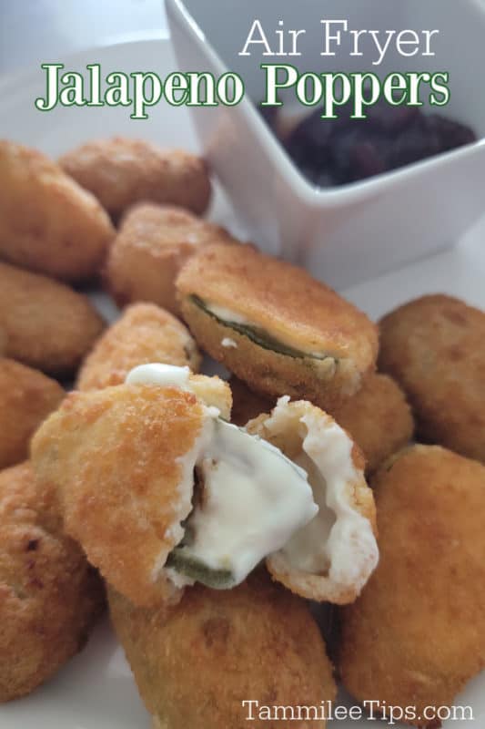 Air Fryer Jalapeno Poppers over a plate of jalapeno poppers with one split open. 