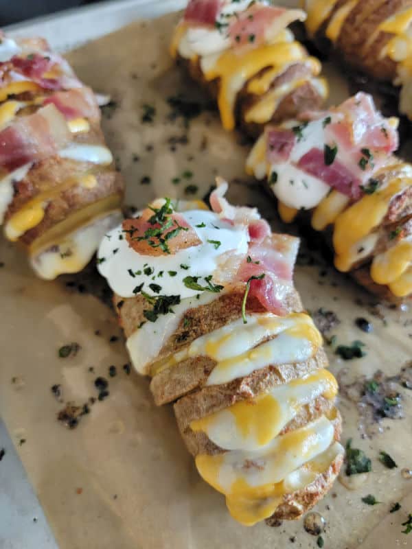 baked hasselback potatoes with sour cream and bacon