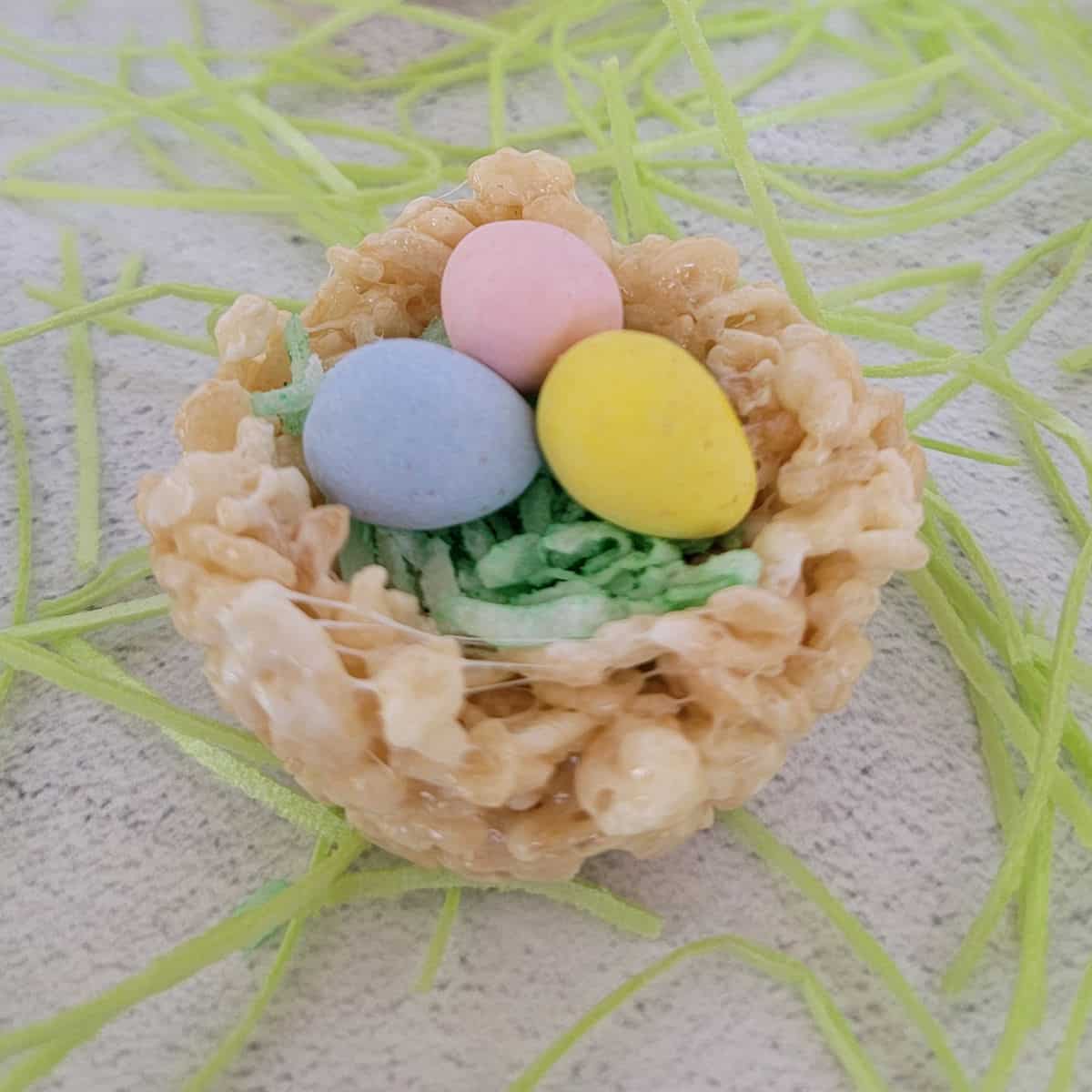 Easter Rice Krispie Nests Surrounded by edible grass