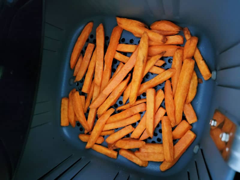 Sweet potato fries in an air fryer basket