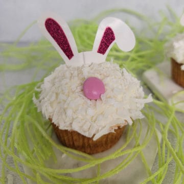 Easy Bunny Cupcake surrounded by green edible grass