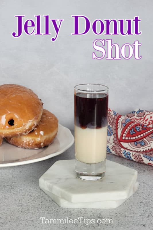 Jelly Donut Shot text over a layered shot on a white coaster next to a plate of jelly doughnuts and a cloth napkin