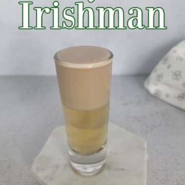 Nutty Irishman text over a layered shot on a white coaster