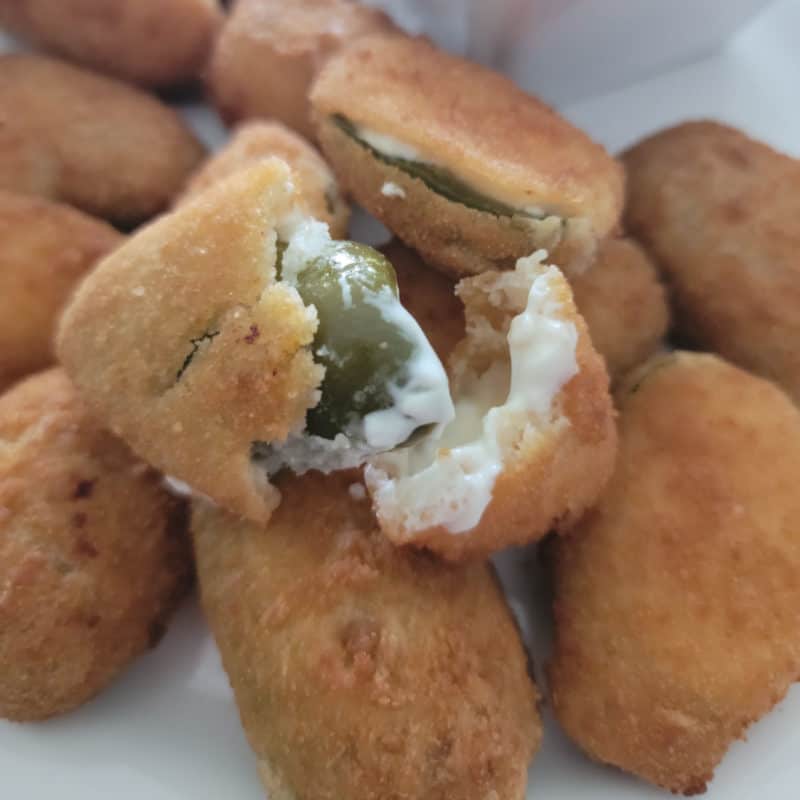 Air fried jalapeno poppers on a white plate