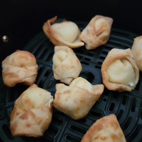 Air fried cream cheese wontons in the air fryer basket