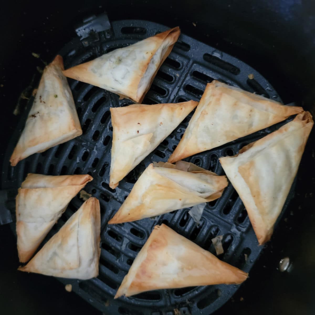 air fried spanakopita in the air fryer basket