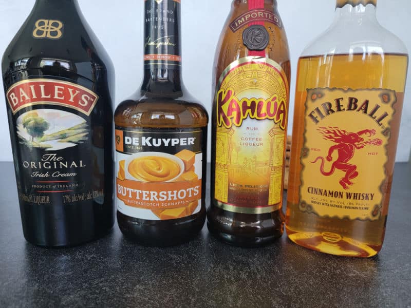 Bottles of Baileys Irish Cream, Buttershots, Kahlua, and Fireball 