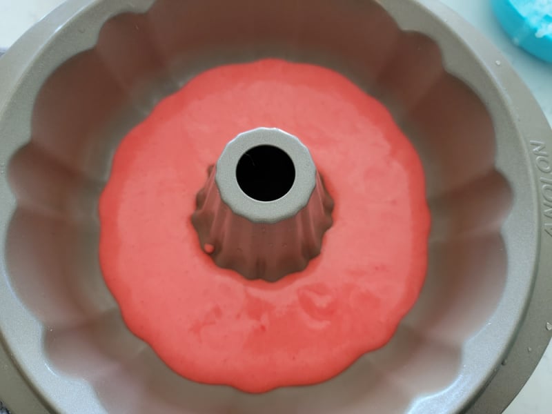 Red cake batter in a Bundt pan