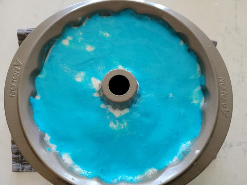 Blue cake batter in a Bundt Pan