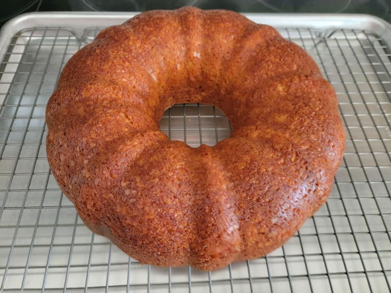 Apple Cider Donut cake on a wire rack
