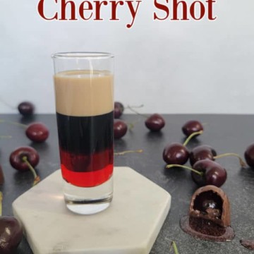 Chocolate covered cherry shot text over a layered shot surrounded by chocolate covered cherries