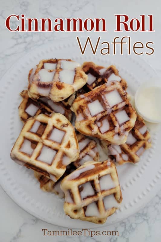 Cinnamon Roll Waffles over a plate filled with waffles covered in icing