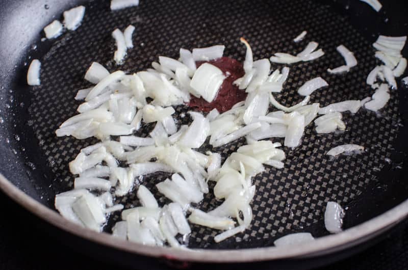 onions browning in a skillet