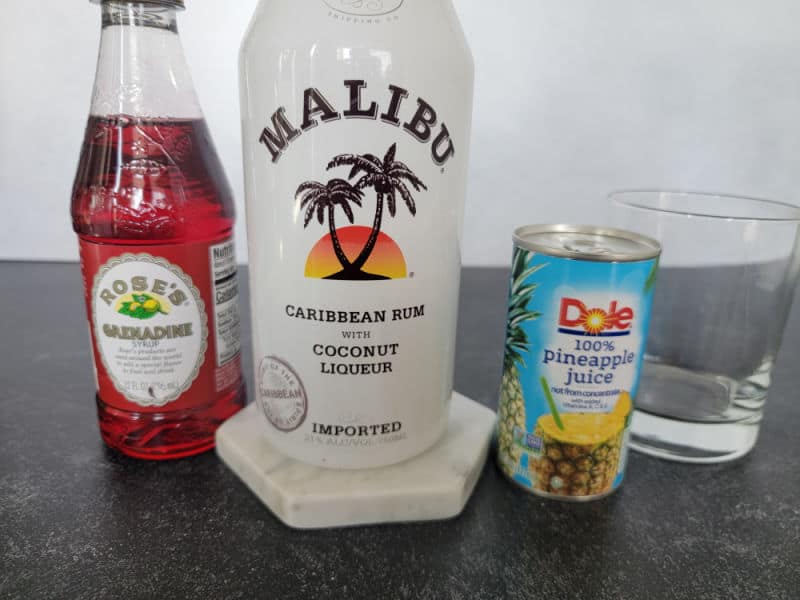 Grenadine, Malibu coconut rum, pineapple juice, and an empty glass