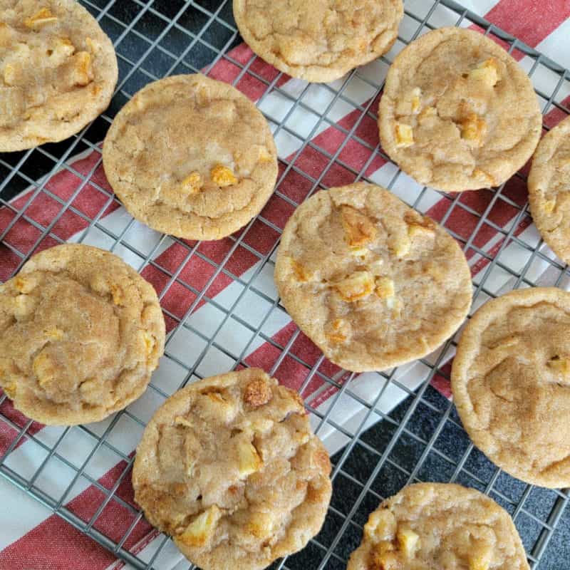 Apple Cider Cookies on a wire rack above a red striped cloth napkin