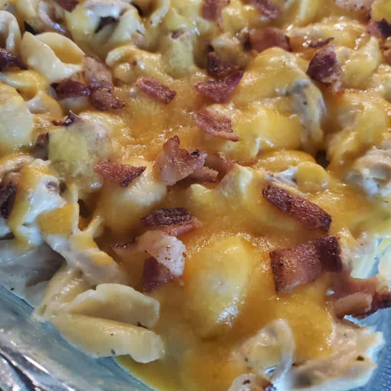 Chicken Bacon Ranch Casserole with melted cheese in a casserole dish