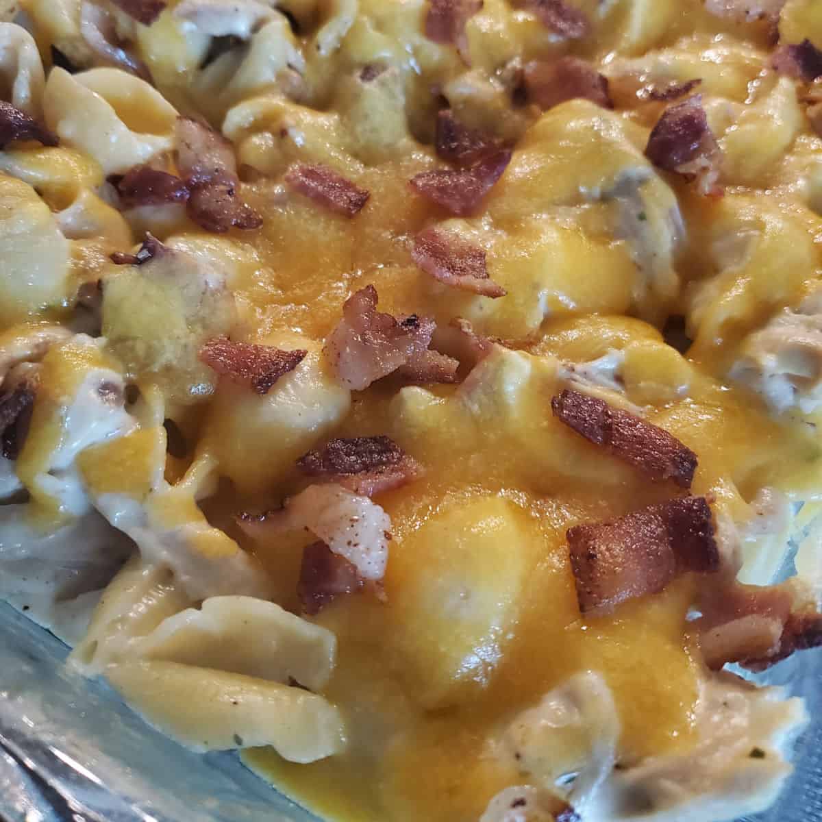 Chicken Bacon Ranch Casserole with melted cheese in a casserole dish