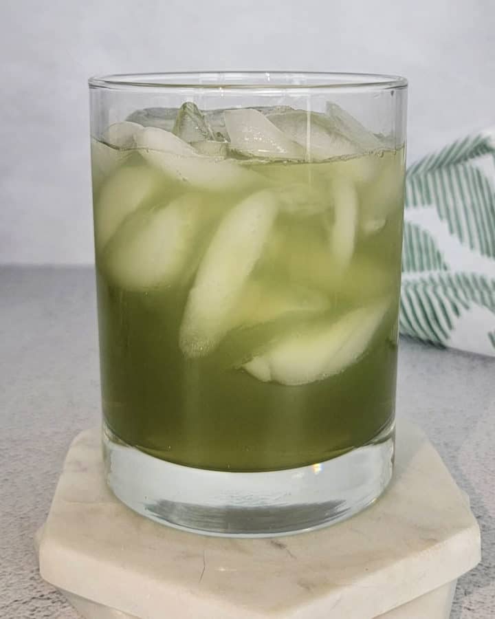 Incredible Hulk Drink in a cocktail glass on a white coaster