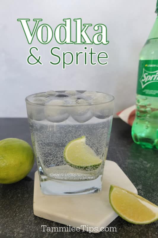 Vodka and Sprite over a cocktail glass with lime wedge garnish on a coaster next to a bottle of sprite and limes