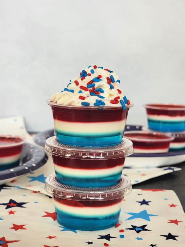 Red White and Blue 4th of July Jello Shots stacked together on a star napkin