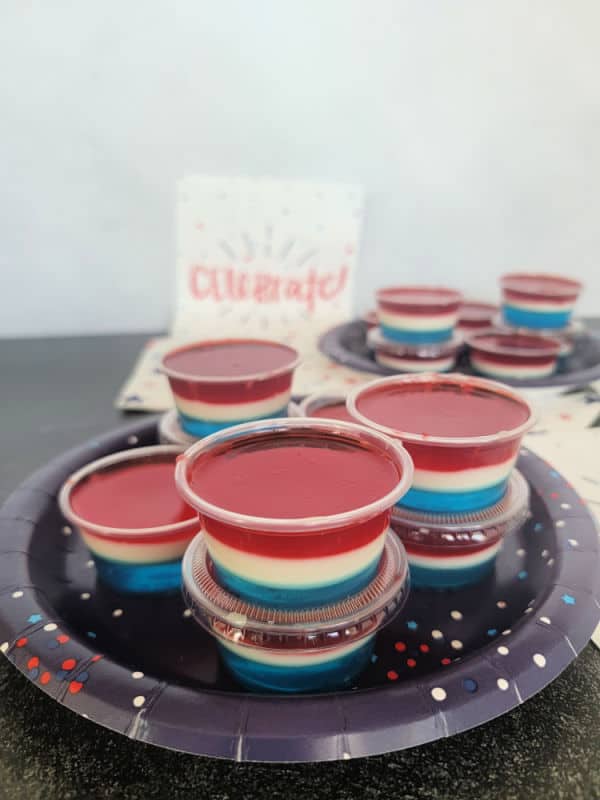 Red White and Blue Jello Shots on a blue plate