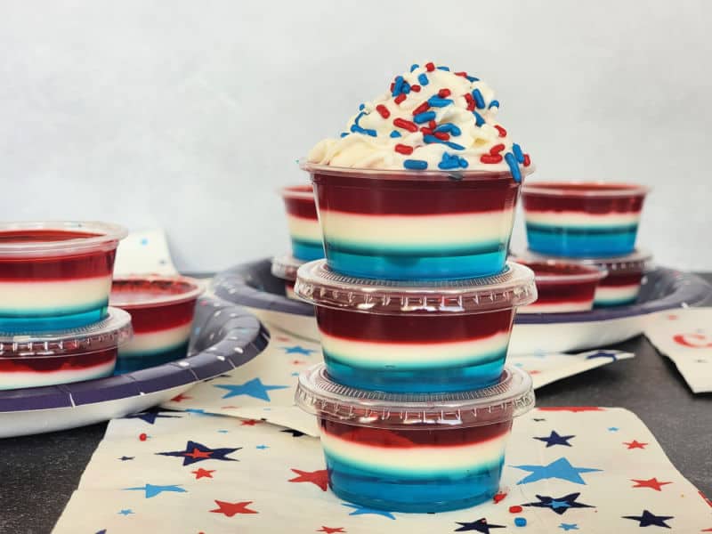 4th of July Red White and Blue Jello Shots stacked together on a star napkin
