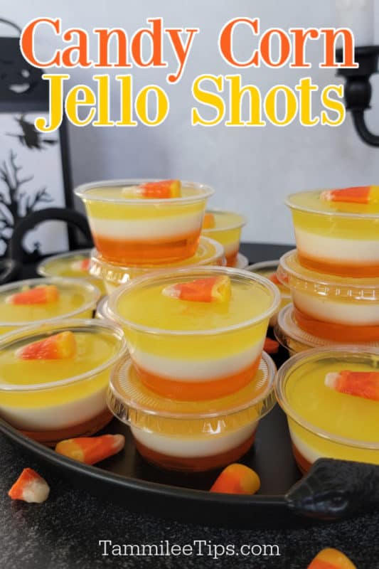 Candy Corn Jello Shots text over a tray of layered jello shots