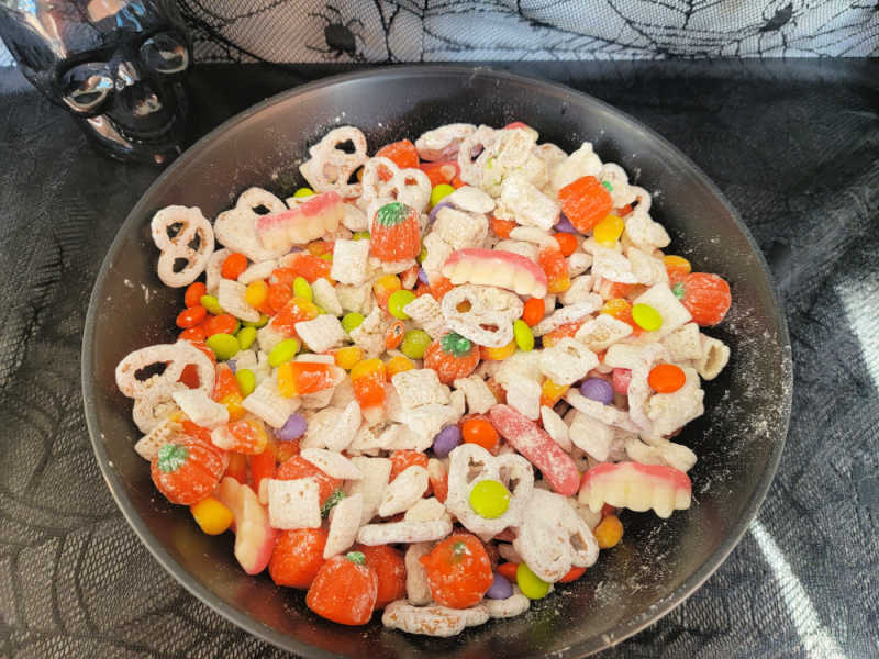 Monster munch in a black bowl on a Halloween cloth