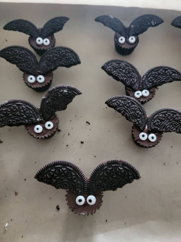 multiple reeses bats on parchment lined baking sheet