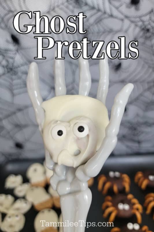 ghost pretzel held in a skeleton hand with ghost pretzels text above