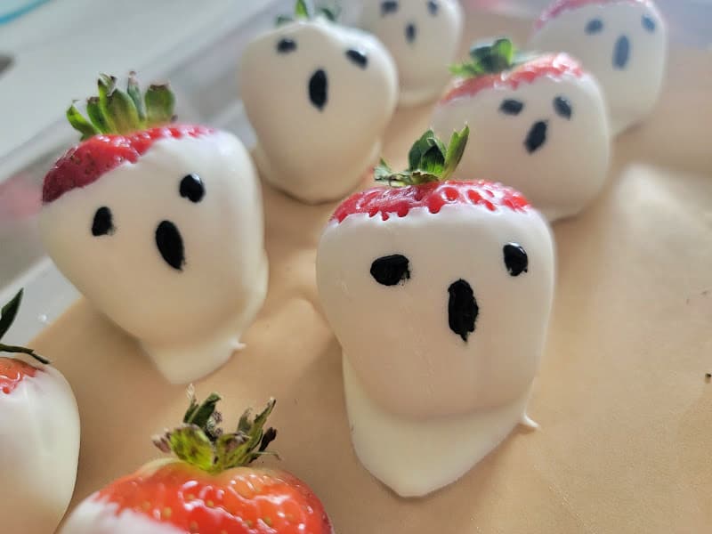 Ghost strawberries on parchment paper