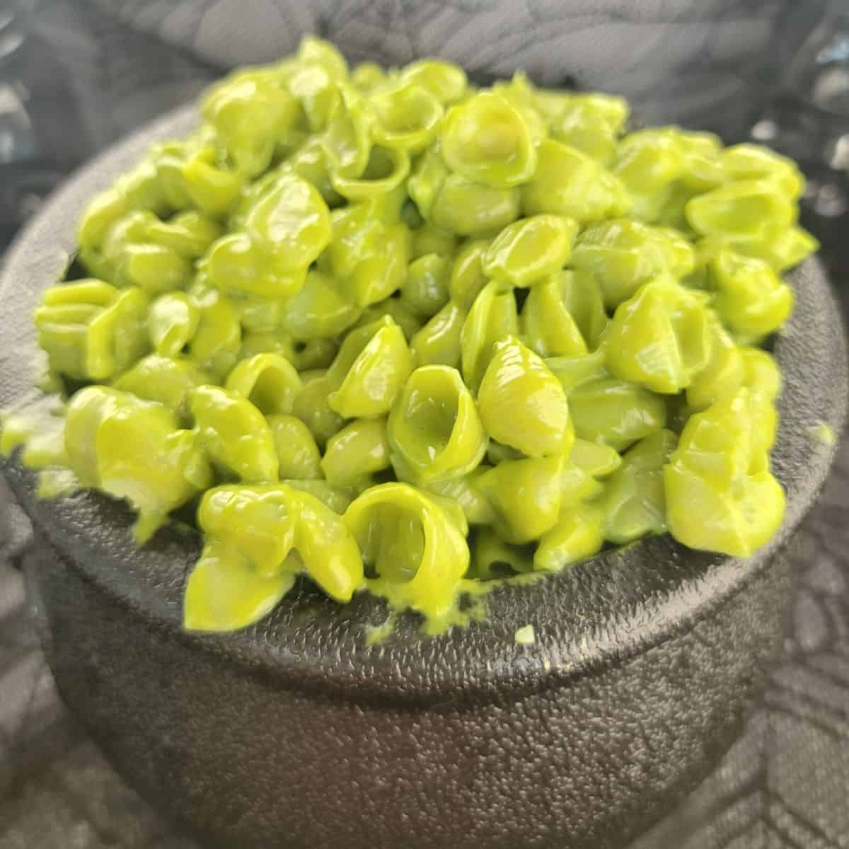 Green Halloween Pasta in a a black cauldron