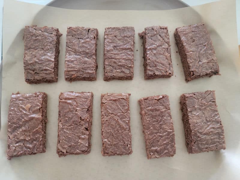 Brownie rectangles on parchment paper