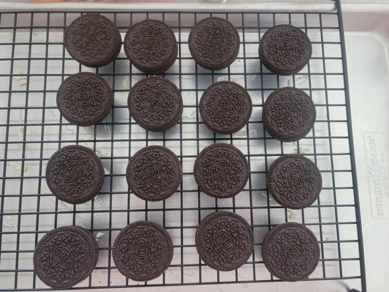 Oreo Cookies on a wire rack in a baking pan