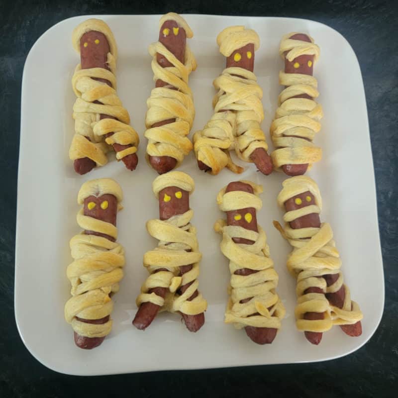 Mummy dogs on a white plate