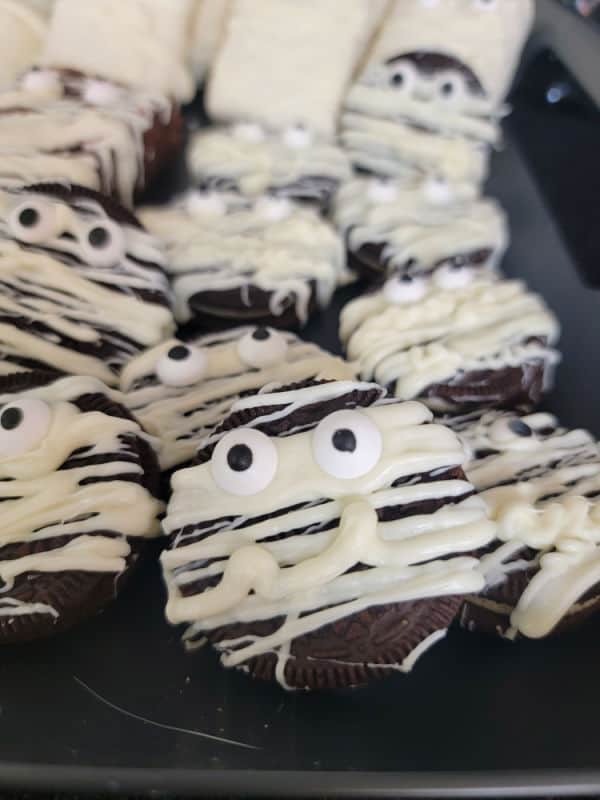Oreo Mummy Cookies on a black platter
