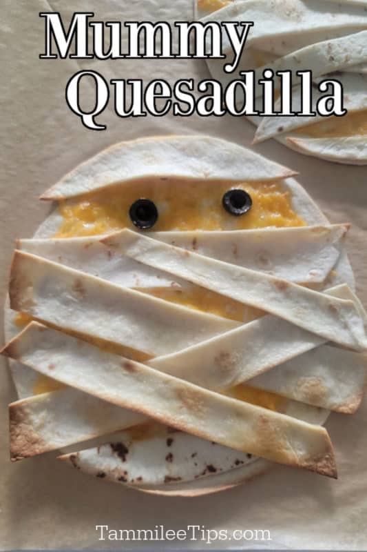 Mummy Quesadilla text over a quesadilla mummy on parchment paper