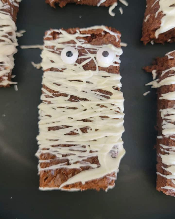Mummy Brownies on a black plate