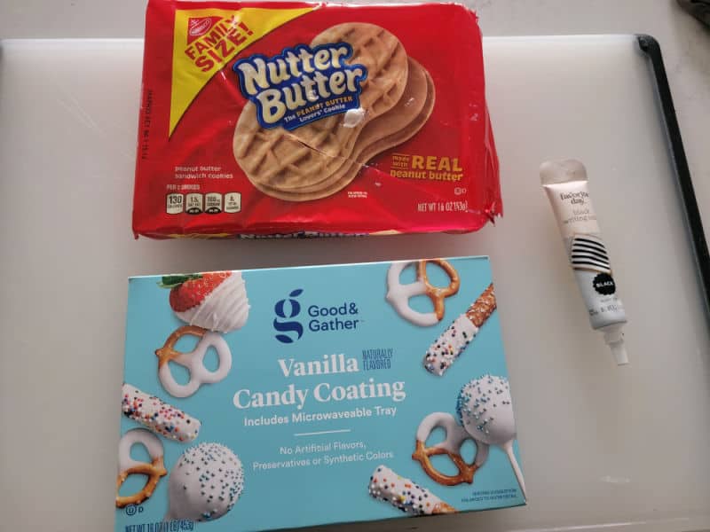 Nutter butter ghost ingredients, nutter butter cookies, vanilla candy coating, black icing pen