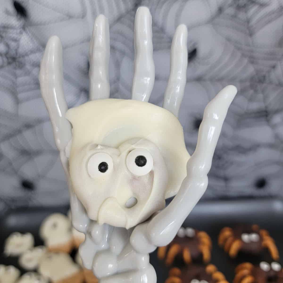 Pretzel Ghosts held by skeleton hand